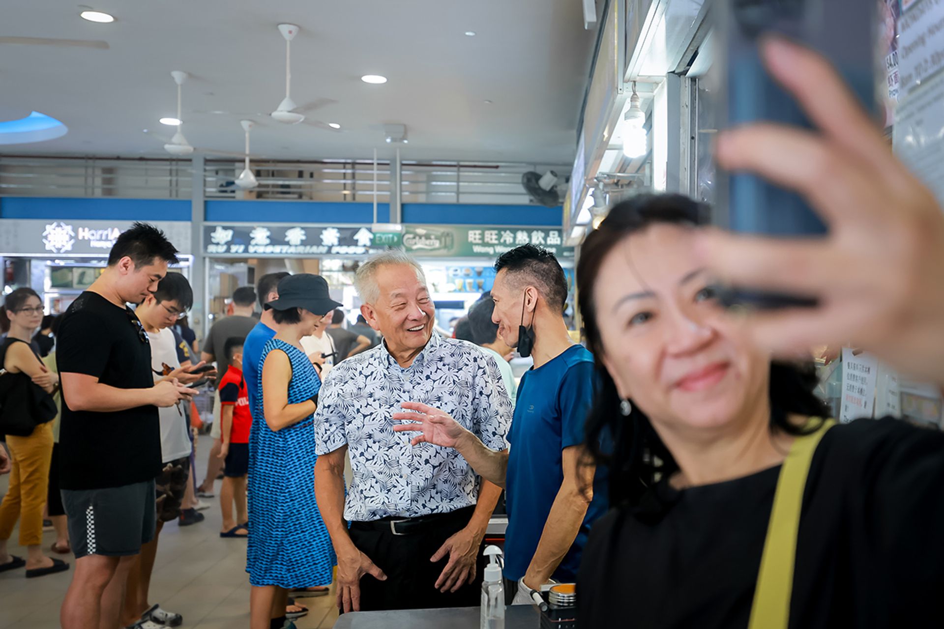 Mr Ng chatting with vendors and patrons at Tiong Bahru Market and Food Centre on Aug 5, 2023. ST PHOTO: GAVIN FOO