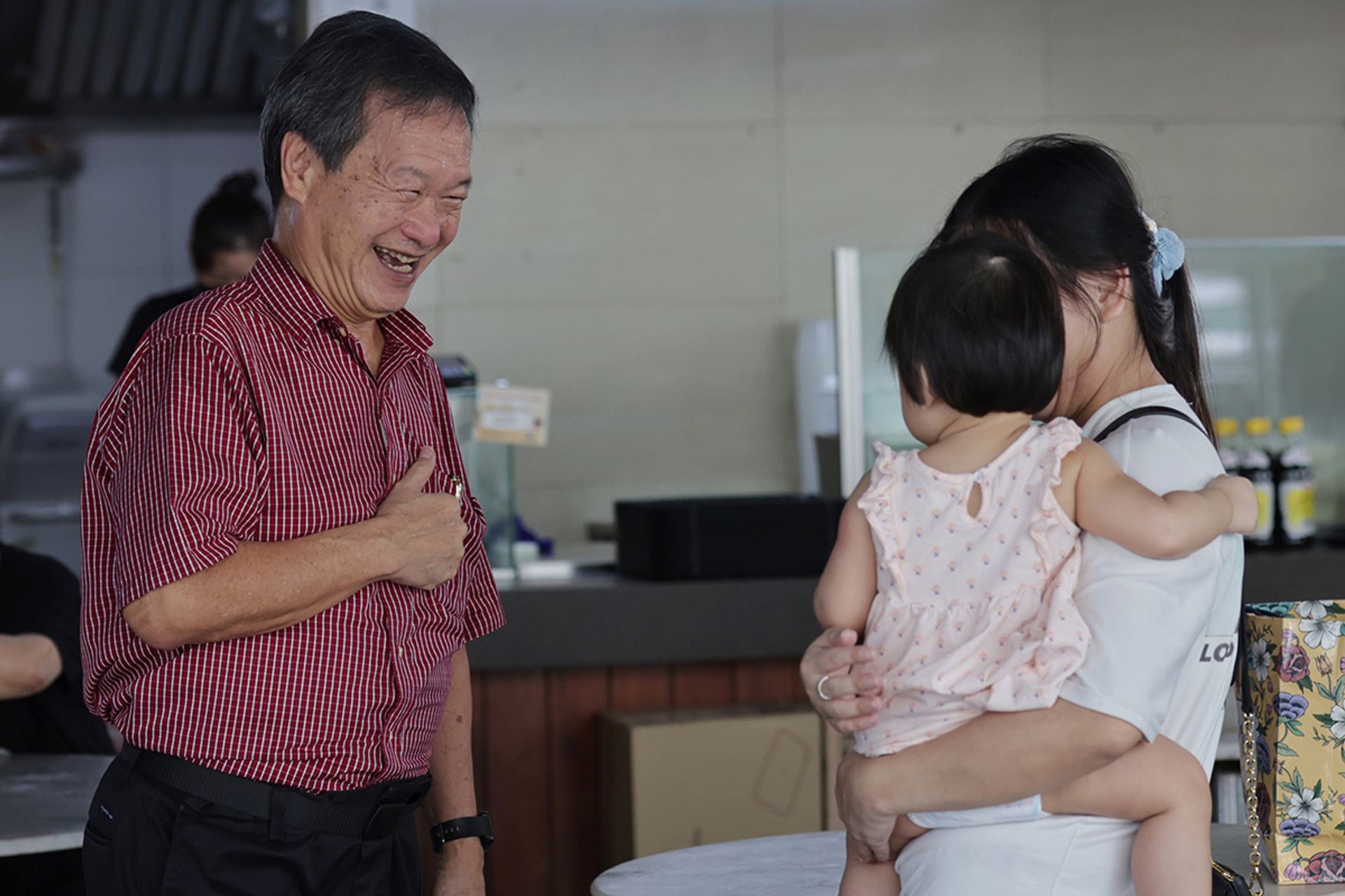 Mr Tan interacting with Sengkang residents at Kopitiam Square on Aug 14, 2023. ST PHOTO: GIN TAY