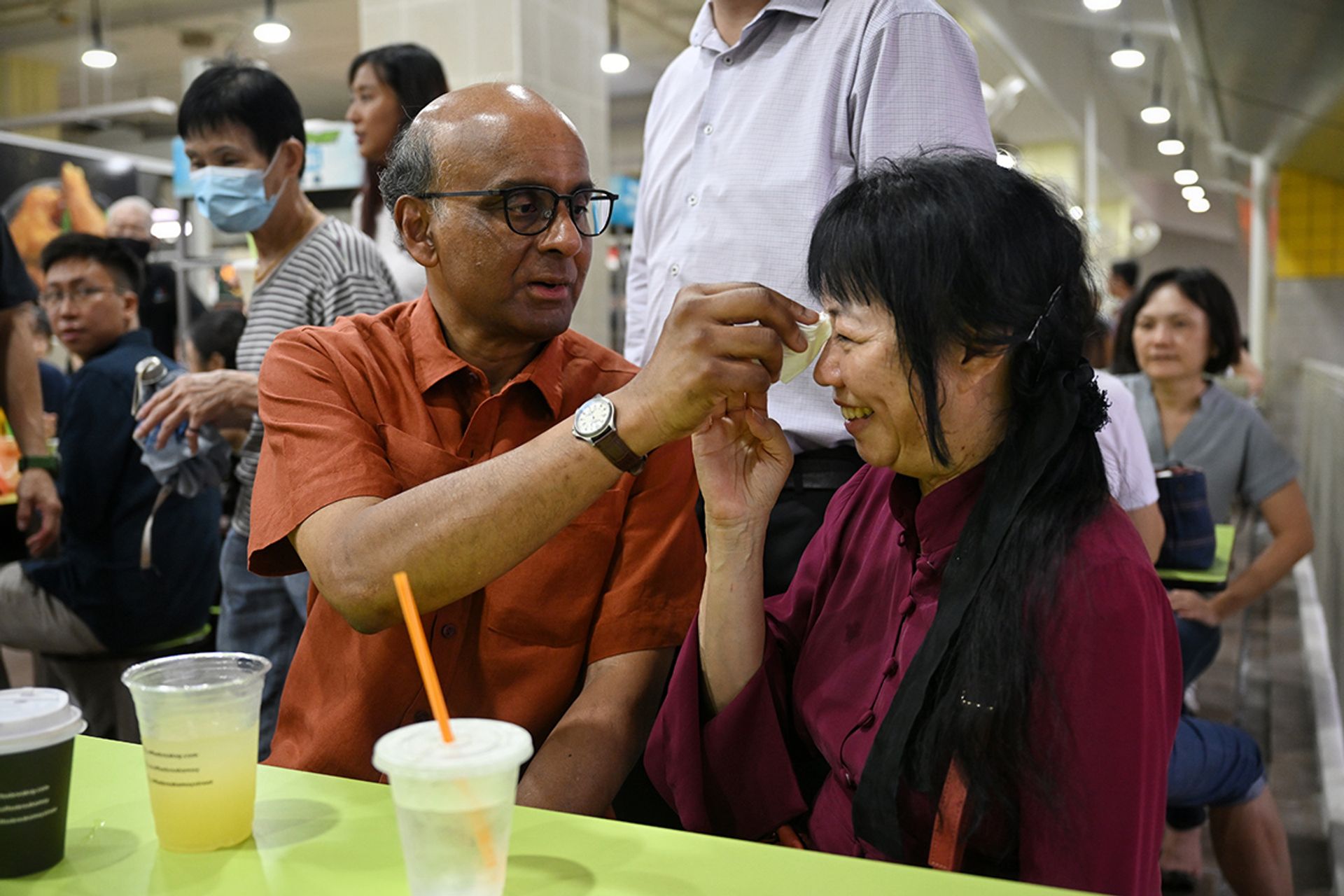 Mr Tharman and his wife Jane Ittogi stopping for a break at Amoy Street Food Centre on Aug 25, 2023. ST PHOTO: SHINTARO TAY