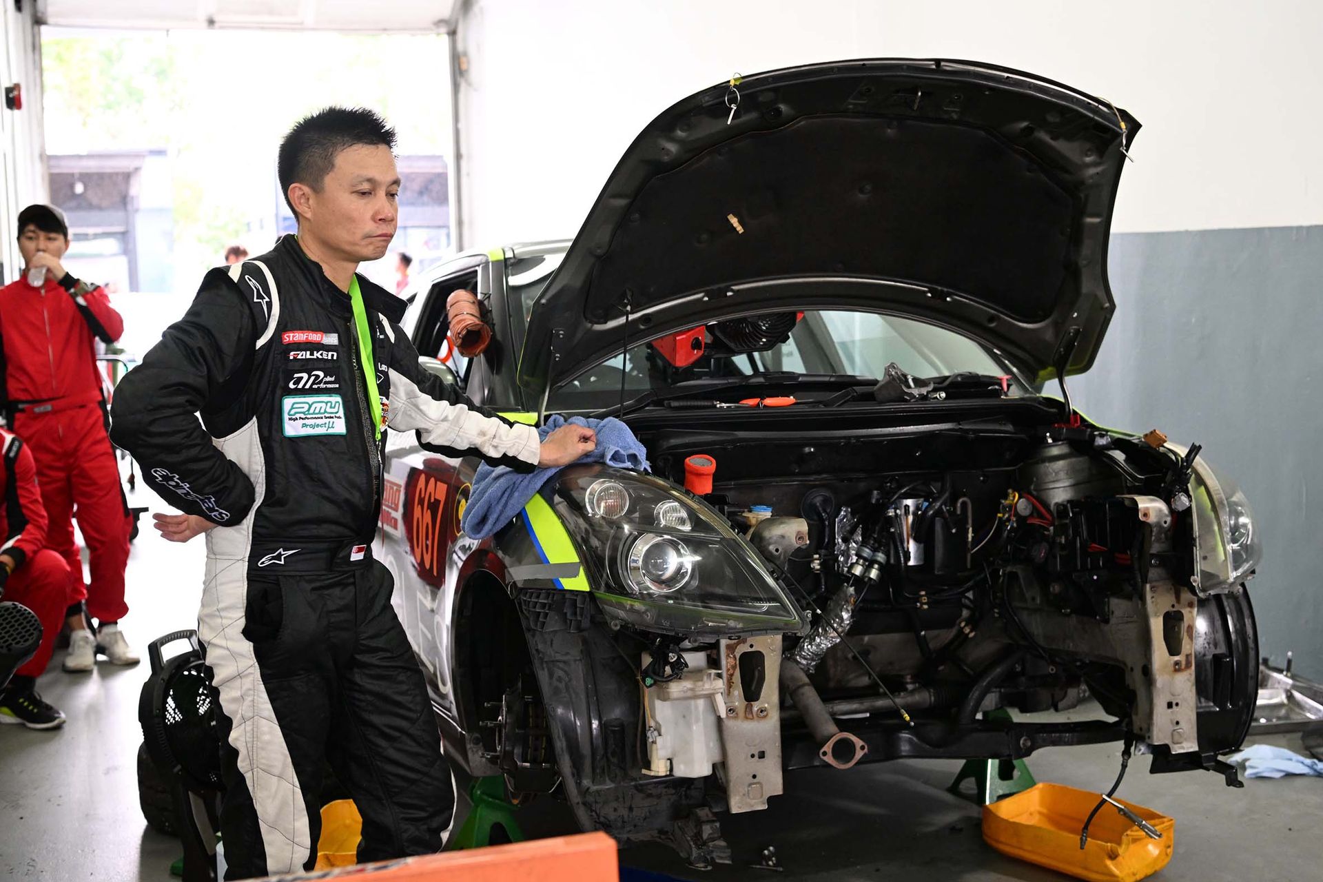 Mr Chester Chua, chief mechanic and strategist of Team 667, awaiting a replacement engine for the Suzuki Swift Sport that overheated less than two hours into the nine-hour race.
